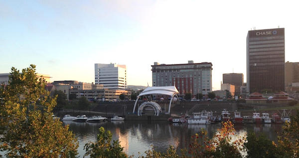 An image of downtown Charleston, WV that includes Haddad Riverfront Park and the Kanawha River and represents the benefits available to investors who undertake projects in Charleston, WV Opportunity Zones.