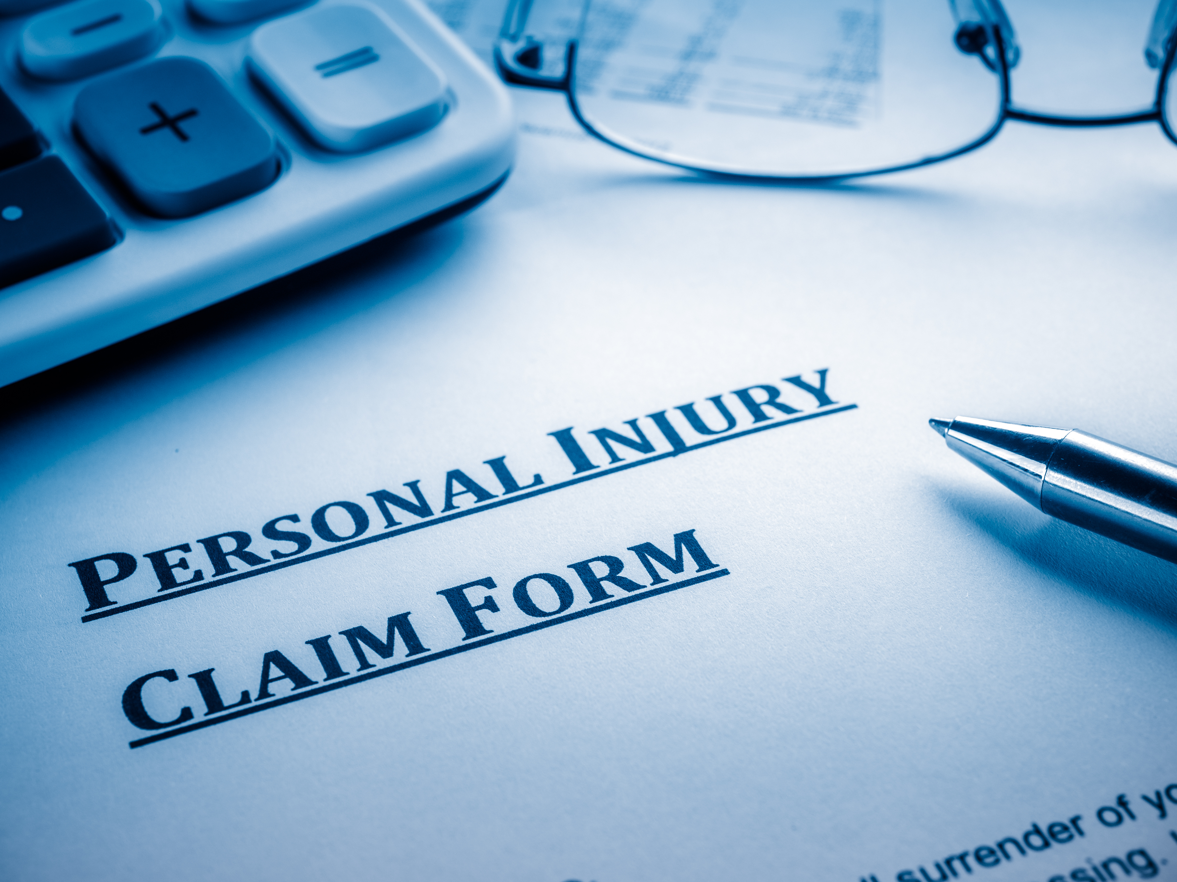 Image of an injury claim form, representing the need for employers to know about WV workers' compensation compensability.