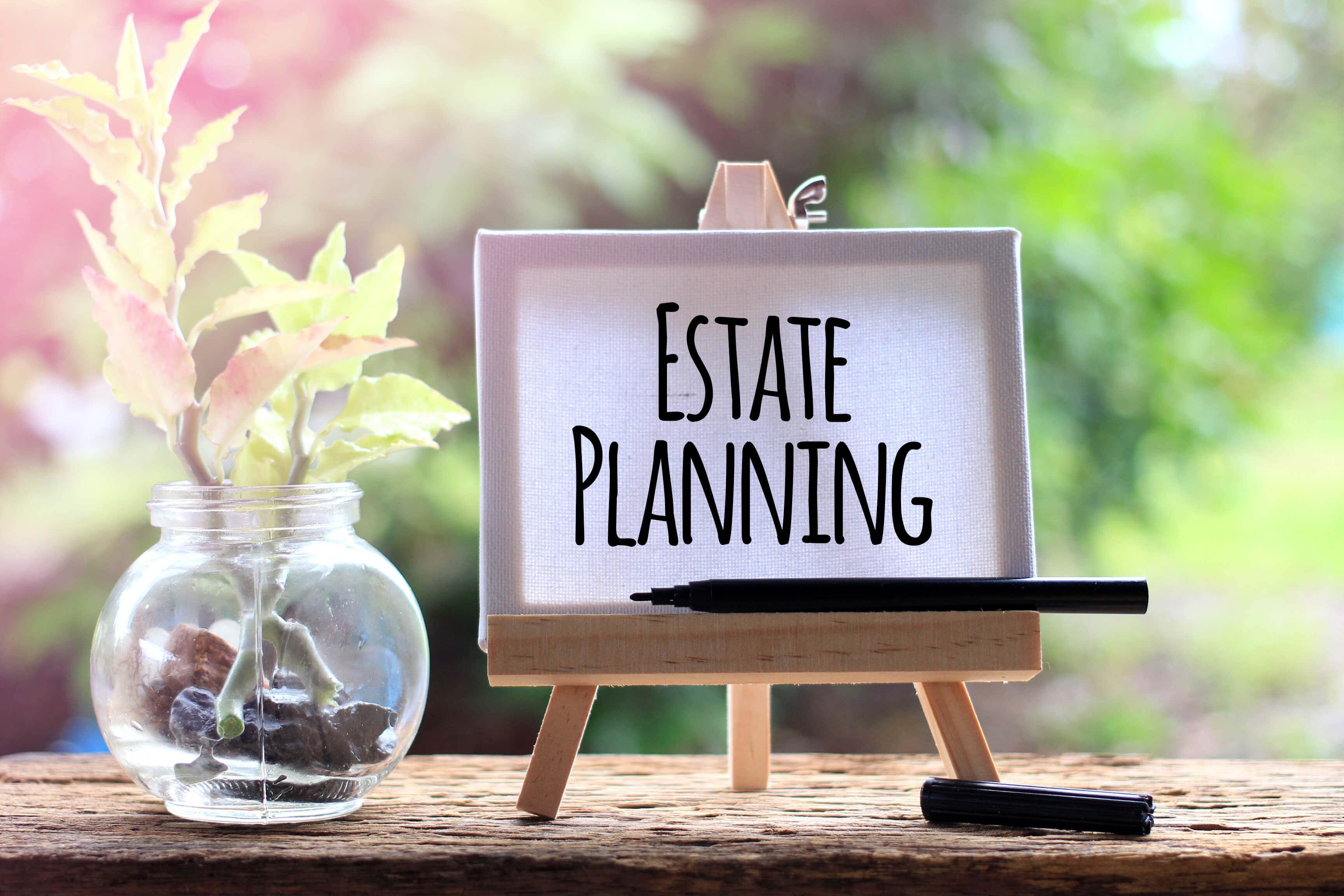 Image of an easel holding a sign which reads estate planning, representing how you can turn to Jenkins Fenstermaker, PLLC for advice on high net worth tax planning and high asset estate planning.