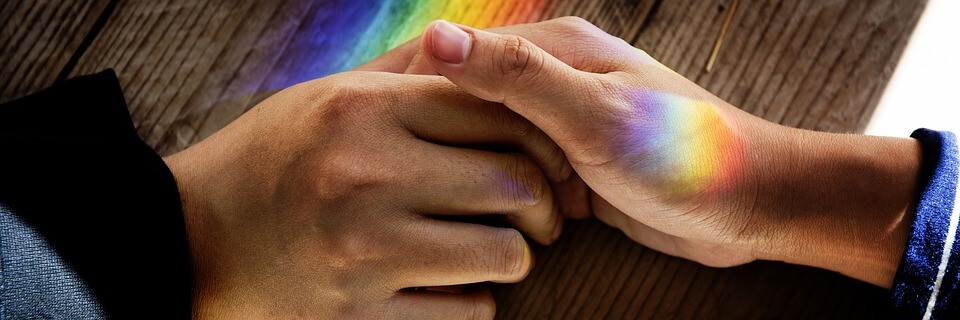 A close-up image of two adults holding hands, representing the need to know when to apply for guardianship of an adult in WV in order to protect a loved one who is incapacitated.