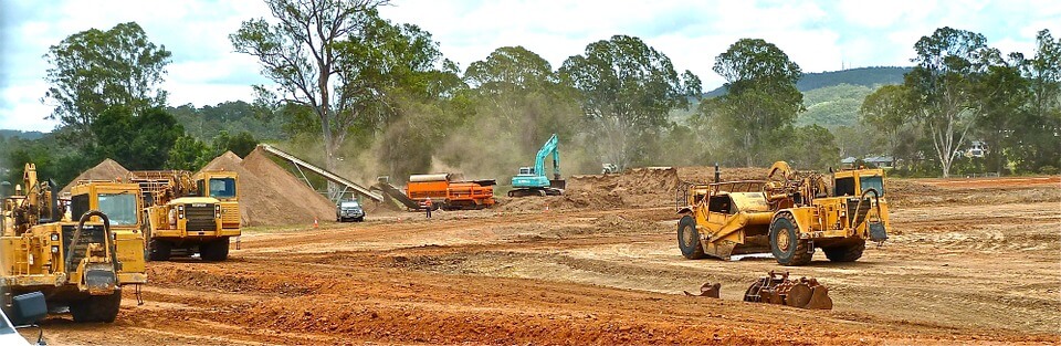 Image of a bulldozer clearing land in preparation for development, representing how Jenkins Fenstermaker can help you identify, invest in, and develop Huntington, WV Opportunity Zones.