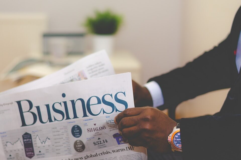 Image of a man reading a business article, representing that a WV business divorce can occur as a company grows and the need for an experienced law firm to handle legal aspects of the separation.