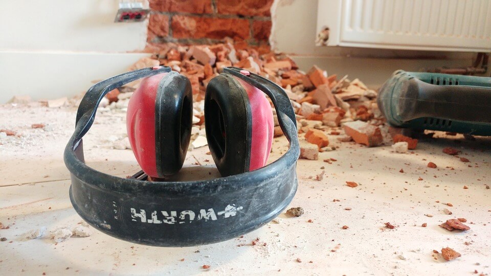 Image of a set of headphones used to protect hearing in an industrial setting, representing a workers' compensation claim and the need to contact an experienced attorney when you have been deemed the chargeable employer in a hearing loss claim.