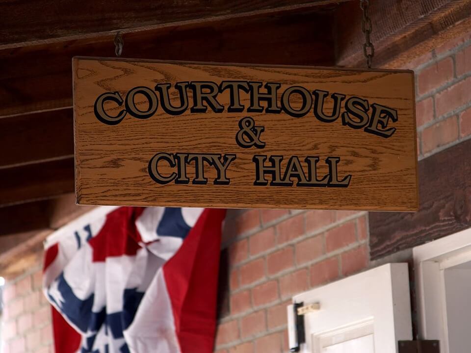 Image of a sign reading “Courthouse and City Hall,” representing how Anna M. Price can help you navigate the new rules for administering an estate during the coronavirus pandemic in WV, KY, and OH.  