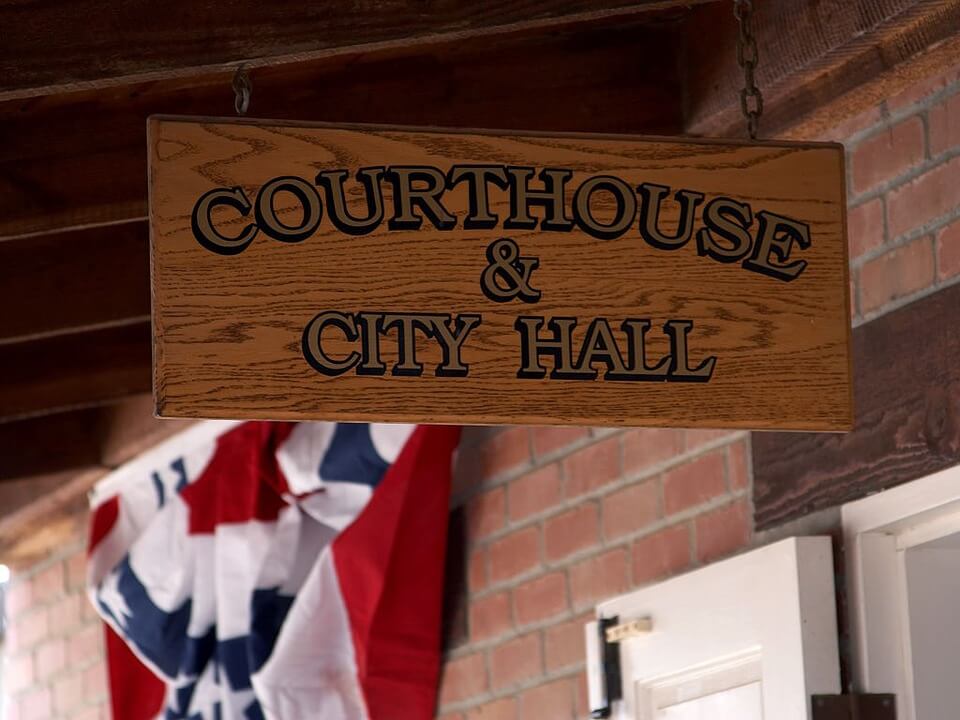 Image of a sign reading “Courthouse and City Hall,” representing how Anna M. Price can help you navigate the new rules for administering an estate during the coronavirus pandemic in WV, KY, and OH.