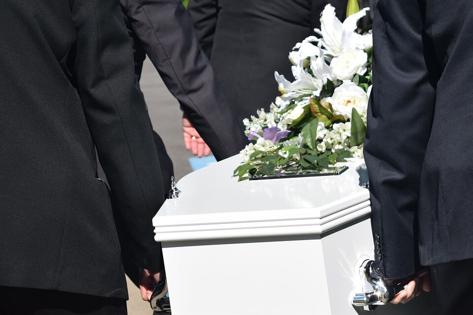 Photo of pallbearers carrying a casket, representing how Anna M. Price of Jenkins Fenstermaker can help the loved ones left behind navigate the probate process without a will in Ohio.