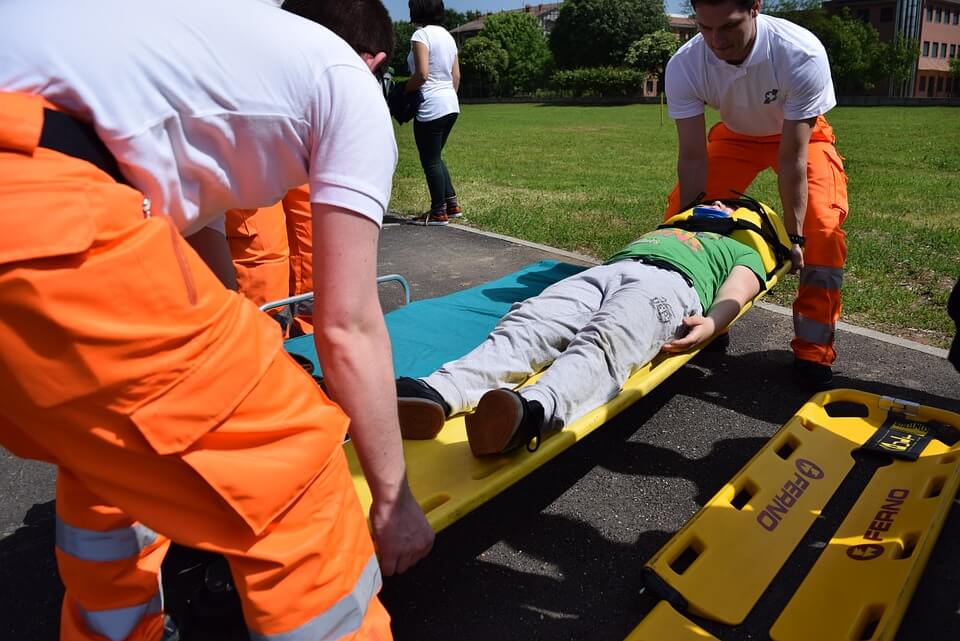 Image of a man being carried on a stretcher, serving as a reminder of how important it is to have a medical power of attorney in WV in place before the unimaginable happens.