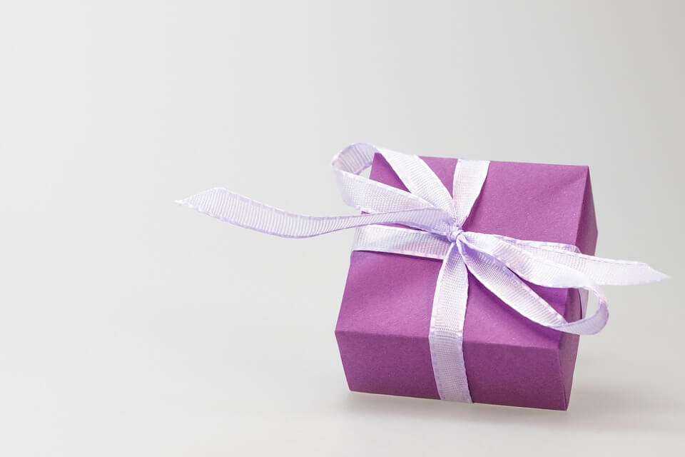 Image of a wrapped gift, representing the benefits of a charitable remainder trust in your estate plan, as explained by attorney Anna M. Price.