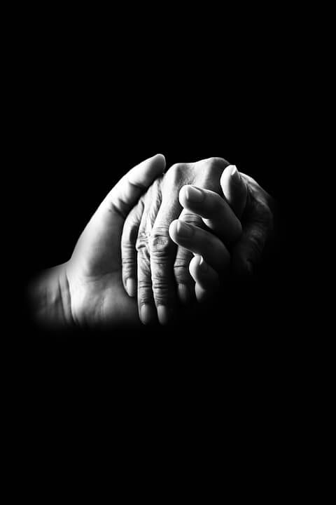 This image depicts two hands holding. Meet with Anna M. Price, an experienced estate planning attorney at Jenkins Fenstermaker, to learn how to serve as a helping hand for future generations by using strategies for charitable giving in WV estate plans.
