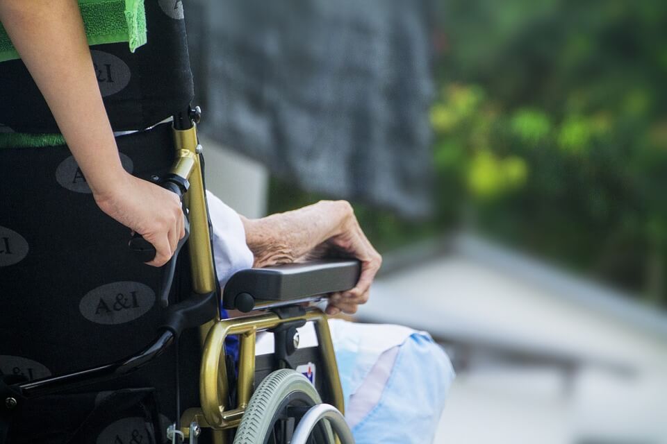 Image of an elderly patient in a wheelchair, representing how a Jenkins Fenstermaker, PLLC’s estate planning attorney will explain the types of advance medical directives and will help you with your living will or medical power of attorney.