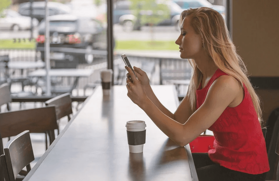 Image of a woman sitting alone at a restaurant counter, representing how Jenkins Fenstermaker can help in the COVID-19 era with hospitality industry challenges in WV.