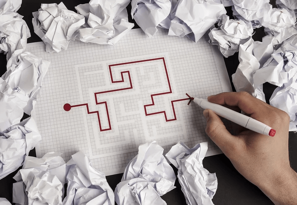 An image of a person’s hand working a maze, representing how Anna M. Price can help you navigate the multiple, complex options in estate planning for business owners.