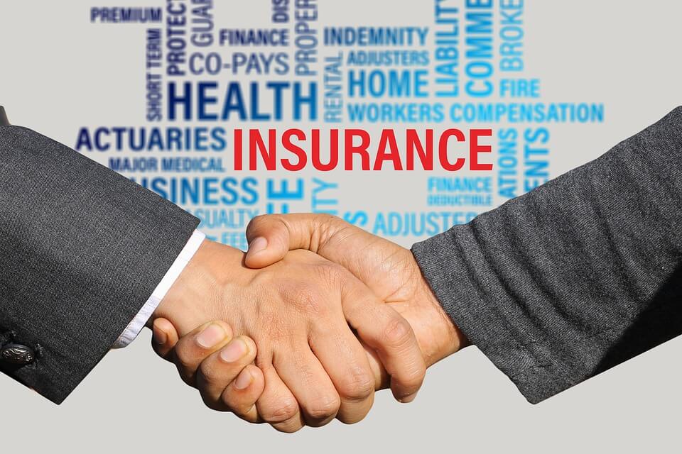 An image of two people shaking hands and the word “insurance” in red with other related terms, representing how an estate planning attorney from Jenkins Fenstermaker may include long-term care partnership programs as part of your comprehensive estate plan in WV, KY, and OH.