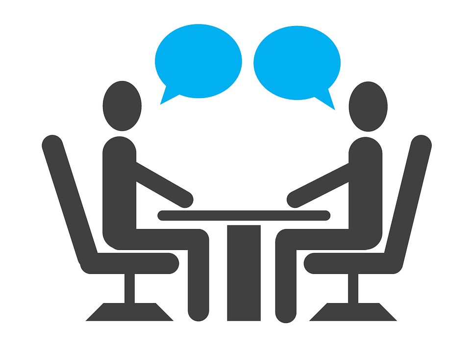 An image of two stick figures in conversation sitting across a table from each other, representing the hiring process and how the attorneys of Jenkins Fenstermaker, PLLC can assist employers in WV, KY, and OH in avoiding and defending failure to hire claims.