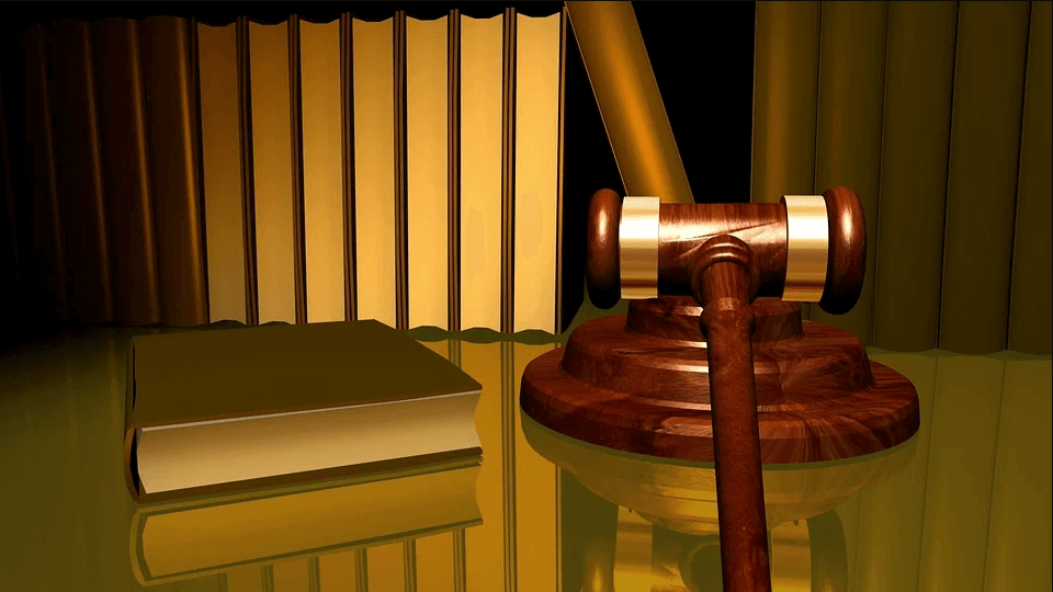 Image of a gavel next to law books, representing how a WV intermediate court of appeals could impact workers' compensation cases, as experienced WV workers' compensation attorney Steve Wellman of Jenkins Fenstermaker, PLLC explains.