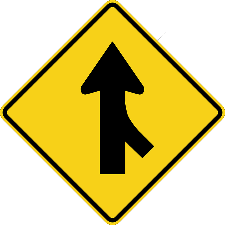 Image of a merging arrow road sign, representing the potential benefits of hospitality mergers and acquisitions and how hospitality industry attorneys can help businesses navigate the M&A process.