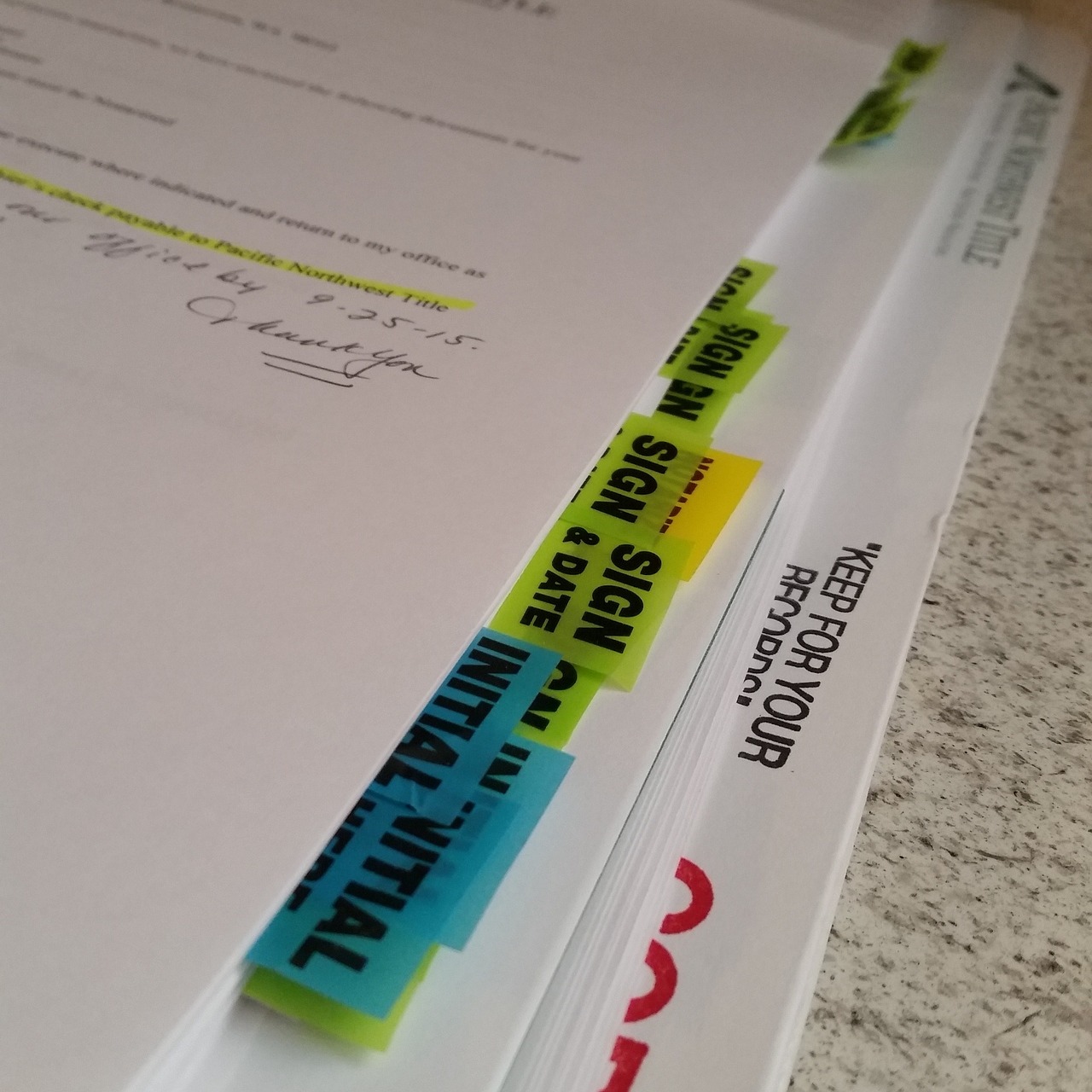 Image of contracts and “sign here” stickers, representing the West Virginia residential closing process and how the guidance of West Virginia real estate closing lawyer Allison J. Farrell can protect you.