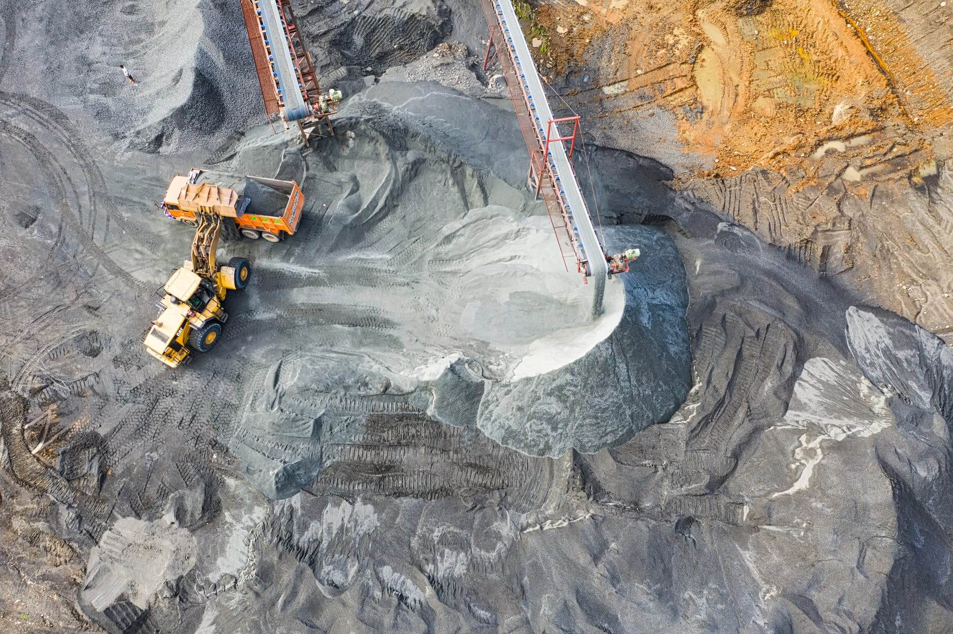 Aerial image of a strip coal mine, representing how black lung defense lawyer James. “Mac” Heslep at Jenkins Fenstermaker helps businesses at risk of black lung claims.