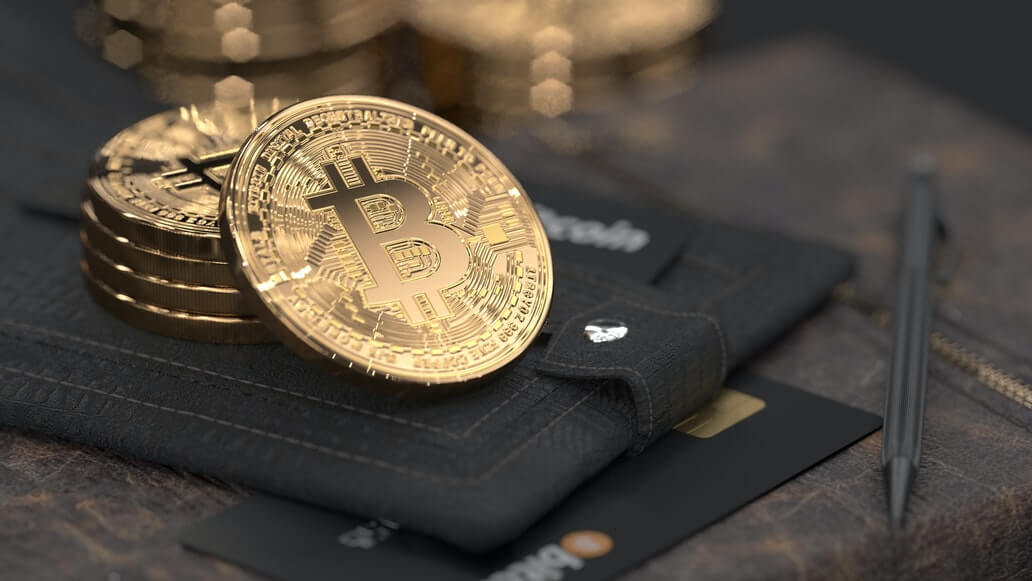 Image of bitcoins and cards on a wallet, representing the new transactions and opportunities available in Bitcoin and Blockchain for restaurants.