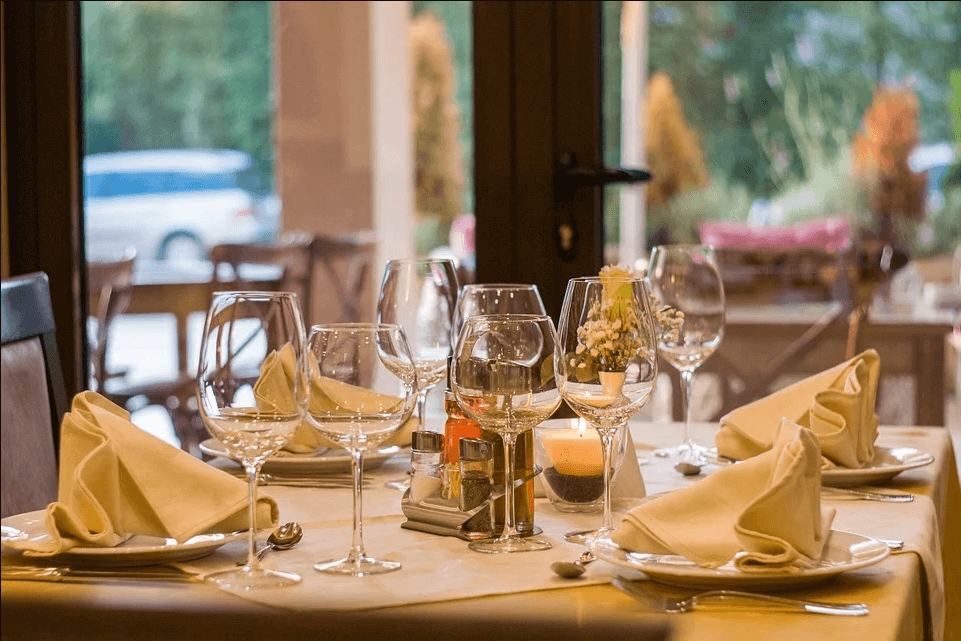 Image of a restaurant table setting, representing the challenges of COVID-19 and how attorneys help clients understand the available pandemic assistance for restaurants, including provisions of the second COVID relief bill.