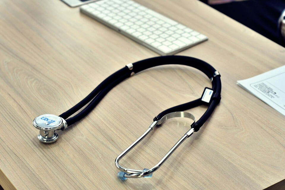 Image of a stethoscope and keyboard on a desk, representing Jenkins Fenstermaker’s explanation of changing terminology for medical evaluations in West Virginia workers’ compensation claims.