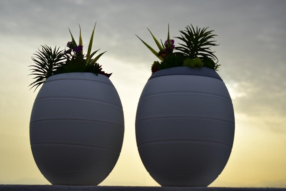 Image of two funeral urns, representing how experienced estate planning attorney Anna M. Price of Jenkins Fenstermaker, PLLC can help answer questions regarding ash scattering in WV.